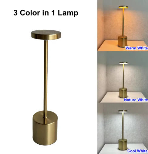 Gold lamp with three color options displayed on a white background.