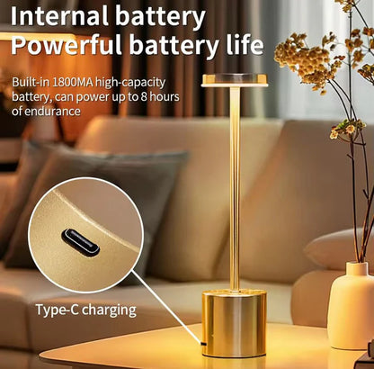 Gold lamp with Type-C charging feature on a blurred living room background