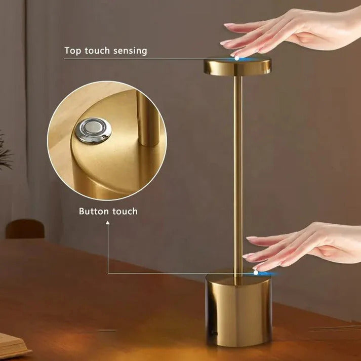 Gold touchless soap dispenser with top and button touch features, hands using it.